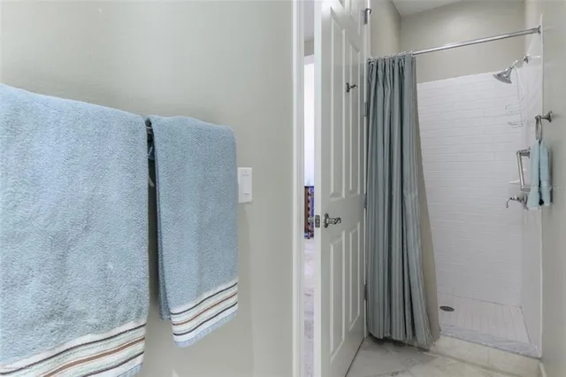 a kitchen with granite countertop a sink a counter top space and cabinets