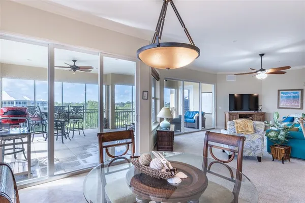 a bedroom with a bed a couch and a large window