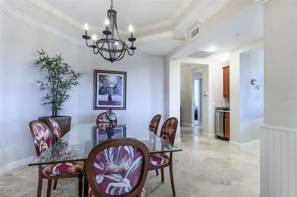 a view of a city from a balcony with chairs