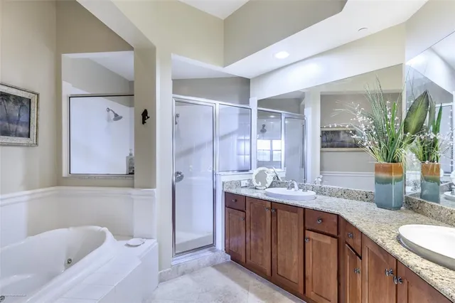 a view of a city from a balcony with chairs