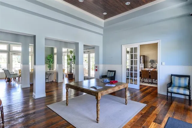 a view of a swimming pool with outdoor seating