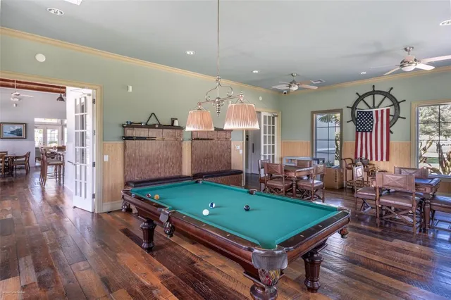 a front view of residential houses with yard and green space