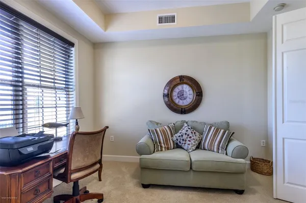 a bedroom with a bed and a dresser in it