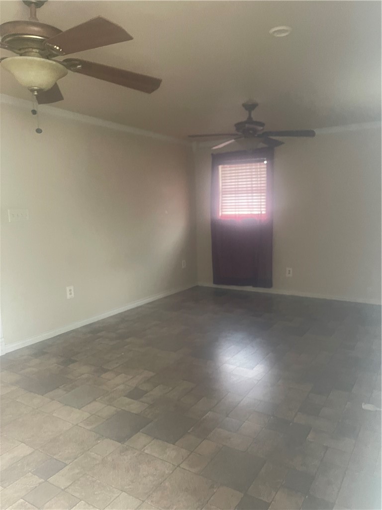 215 West 4th Street Alice, TX 78332 - Photo 11 of 14 an empty room with a empty space and windows