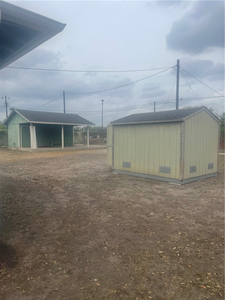 215 West 4th Street Alice, TX 78332 - Photo 3 of 14 a view of a house with a yard