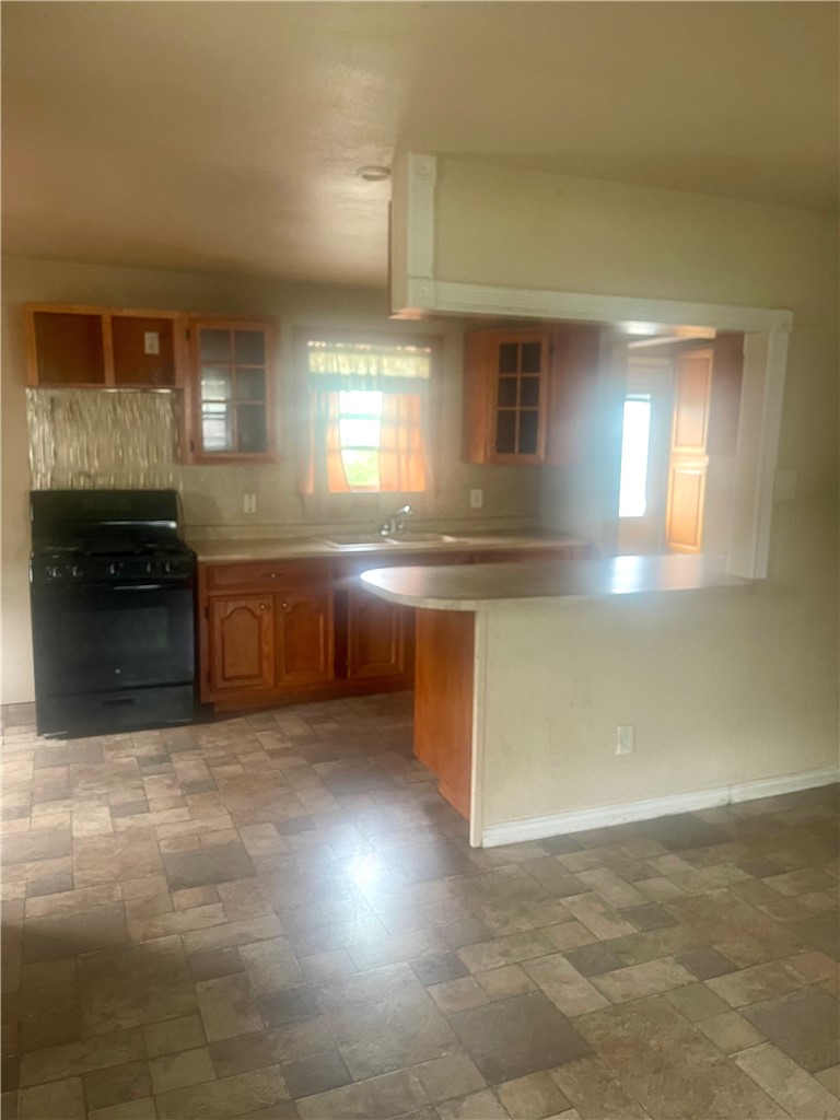 215 West 4th Street Alice, TX 78332 - Photo 4 of 14 a view of a kitchen with a sink