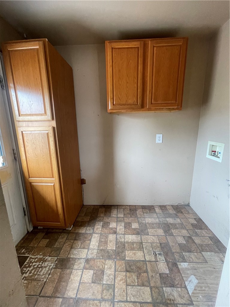 215 West 4th Street Alice, TX 78332 - Photo 6 of 14 a view of a refrigerator in kitchen
