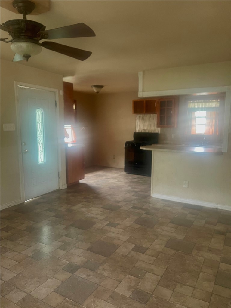 215 West 4th Street Alice, TX 78332 - Photo 7 of 14 a view of a room with a kitchen