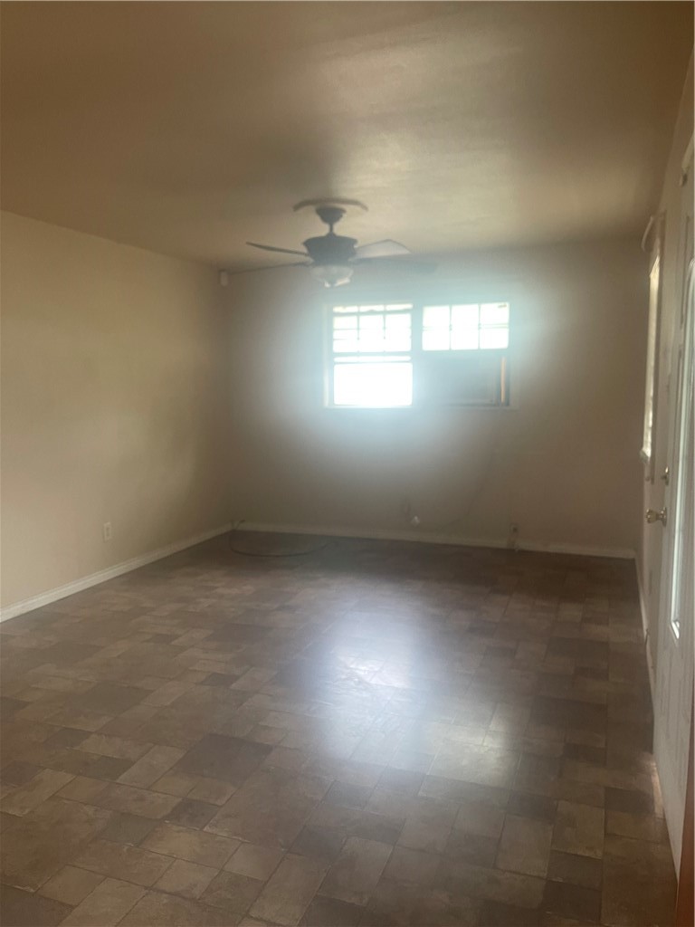 215 West 4th Street Alice, TX 78332 - Photo 8 of 14 an empty room with windows and closet