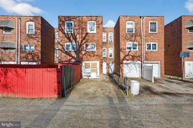 a view of pathway with a wrought fence