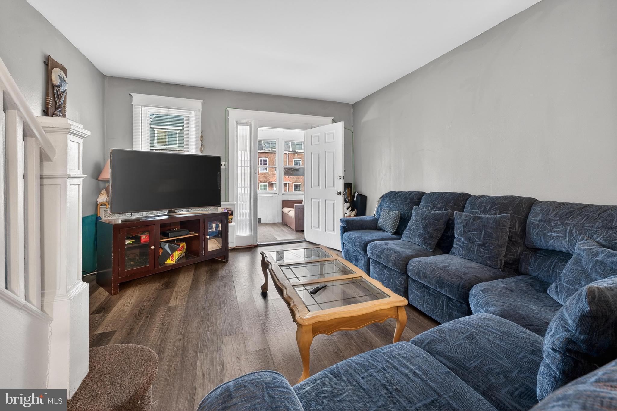1330 South Merrimac Road Camden, NJ 08104 - Photo 3 of 17 a living room with furniture and a flat screen tv
