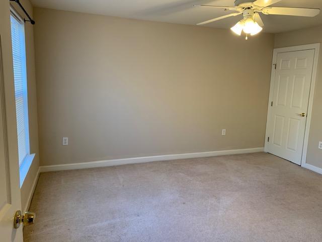 929 Morreene Road, Unit C21 Durham, NC 27705 - Photo 5 of 7 a view of an empty room with a window