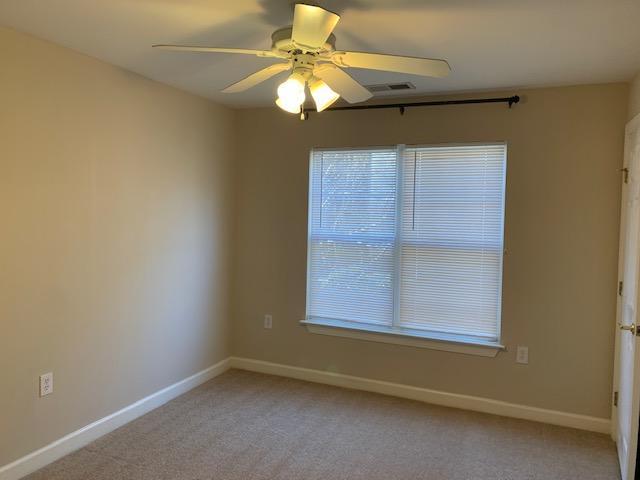 929 Morreene Road, Unit C21 Durham, NC 27705 - Photo 6 of 7 an empty room with a window