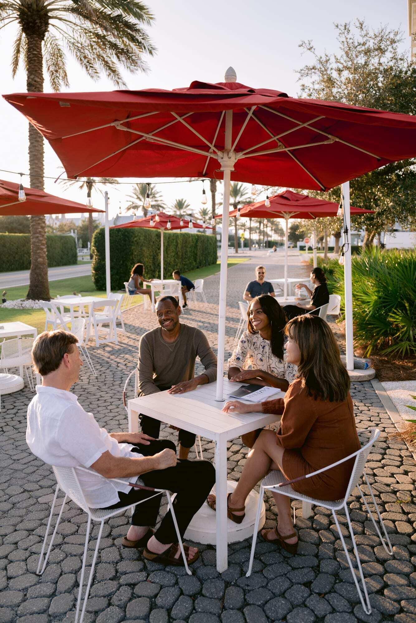 40 Mark Twain Ln Inlet Beach, Unit DANNELLY 301 Inlet Beach, FL 32461 - Photo 15 of 15 a patio with a patio table and chairs