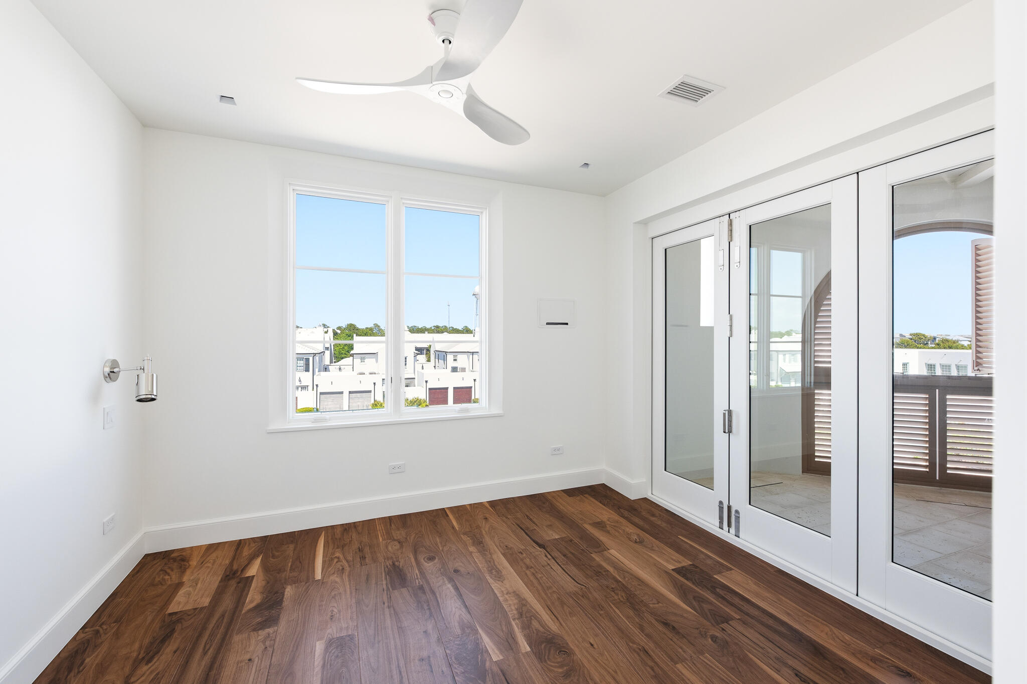 40 Mark Twain Ln Inlet Beach, Unit DANNELLY 301 Inlet Beach, FL 32461 - Photo 24 of 44 a view of an empty room with wooden floor and a window