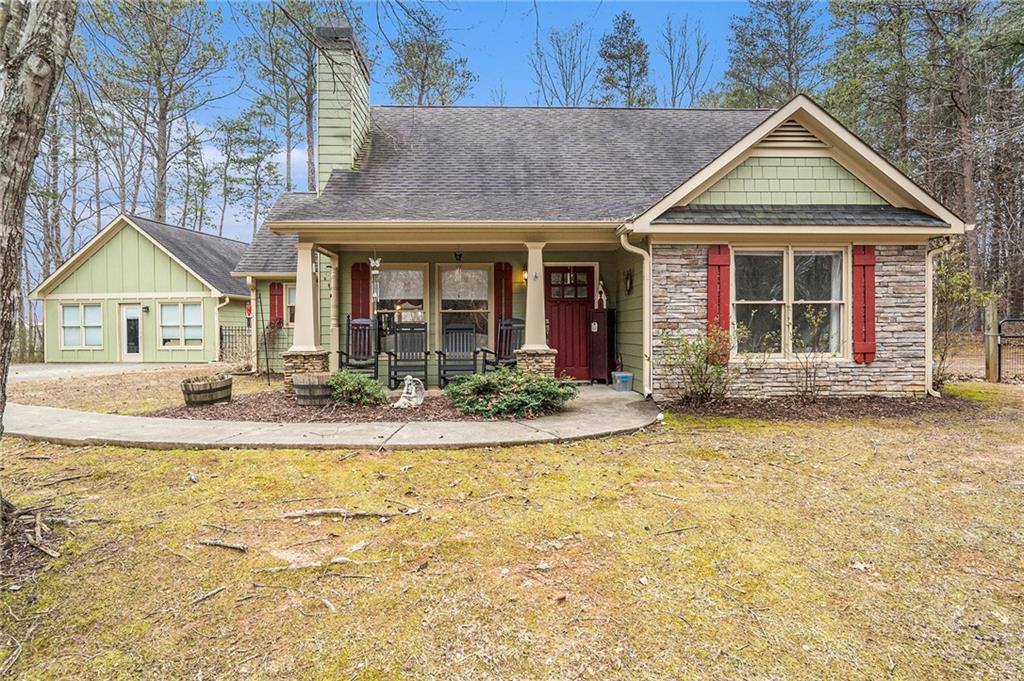 72 Smokestack Ridge Fairmount, GA 30139 - Photo 1 of 1 a front view of a house with a yard outdoor seating and garage