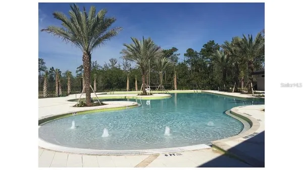 a view of a swimming pool with a sitting space