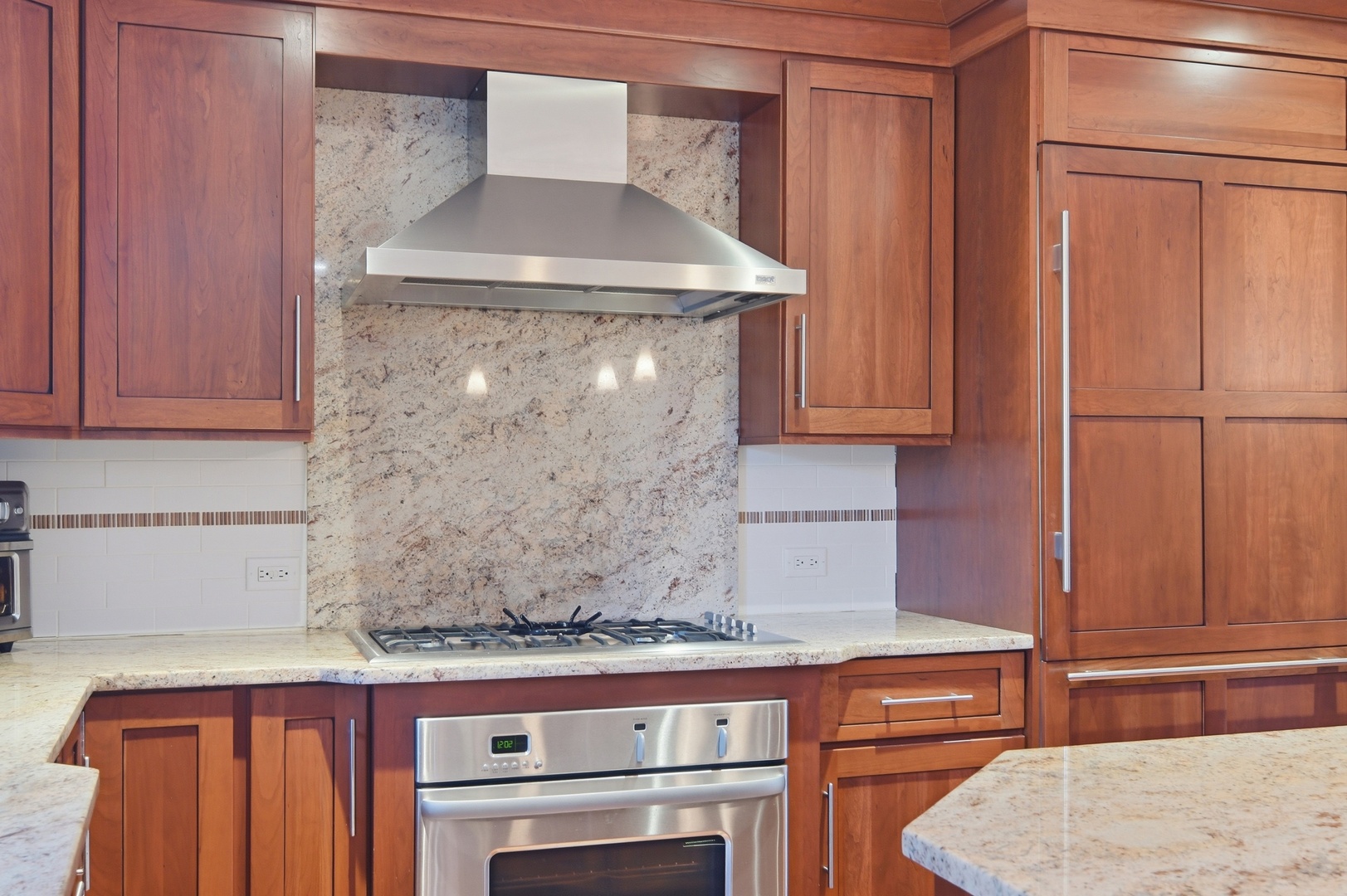 9 Equestrian Way Lemont, IL 60439 - Photo 11 of 32 a kitchen with granite countertop a cabinets and a stove