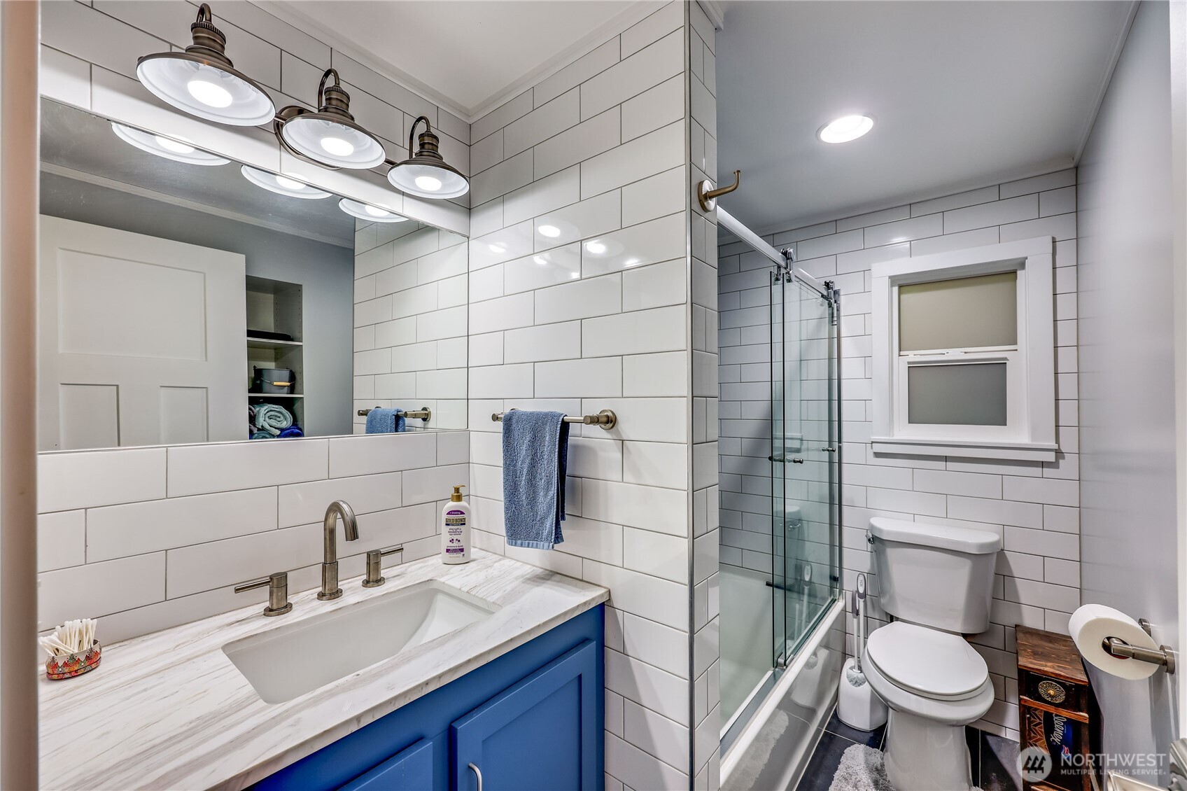 170 Cirque Drive Brinnon, WA 98320 - Photo 15 of 24 a bathroom with a sink a toilet a mirror and shower