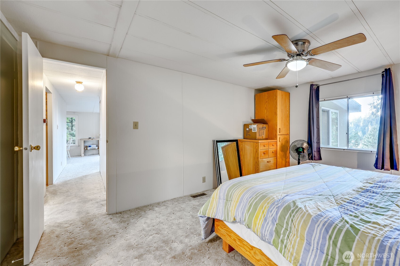 170 Cirque Drive Brinnon, WA 98320 - Photo 18 of 24 a bedroom with a bed and a chandelier