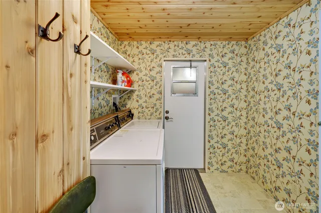 a bathroom with a toilet a sink and a window