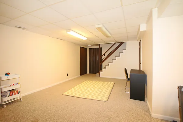 a view of an empty room with stairs