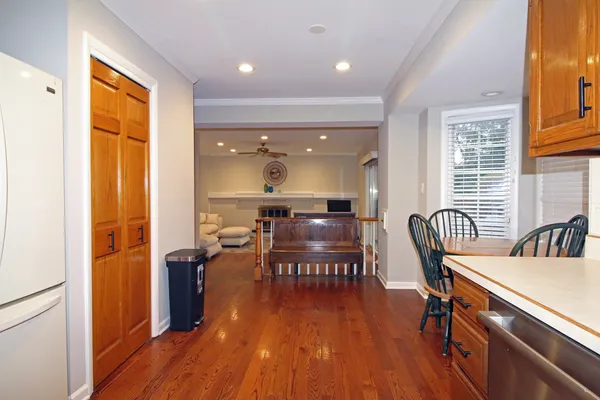 a view of a dining room with furniture and wooden floor