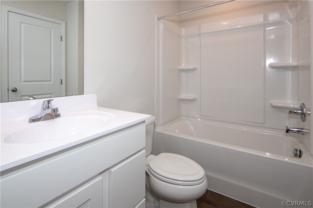 5357 Canterbury Ridge Richmond, VA 23224 - Photo 13 of 14 a bathroom with a sink a toilet and a bathtub
