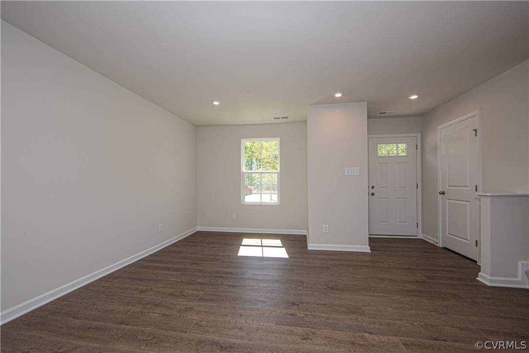 5357 Canterbury Ridge Richmond, VA 23224 - Photo 2 of 14 an empty room with wooden floor and windows