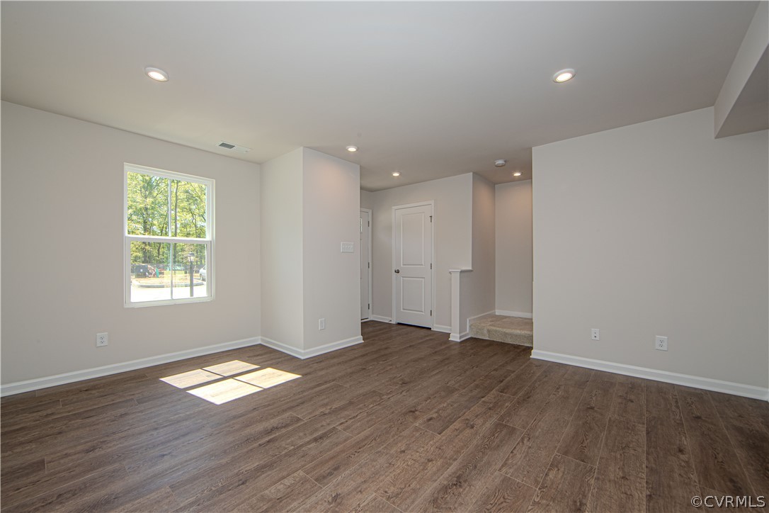 5357 Canterbury Ridge Richmond, VA 23224 - Photo 3 of 14 an empty room with wooden floor and windows