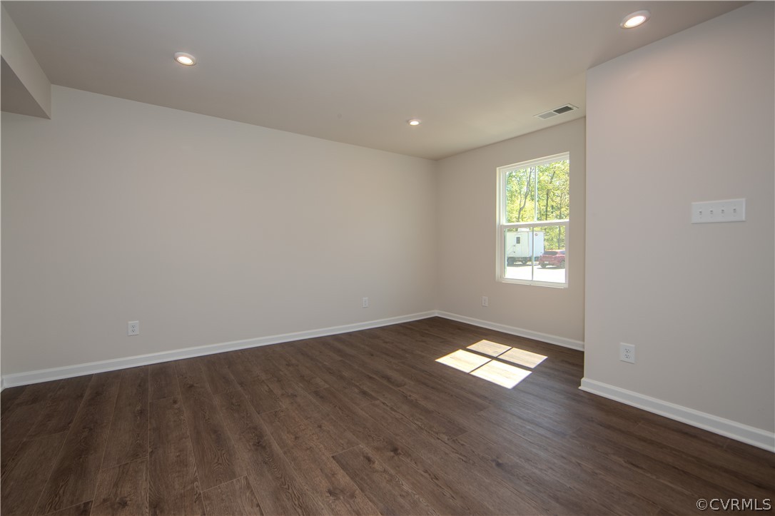 5357 Canterbury Ridge Richmond, VA 23224 - Photo 4 of 14 an empty room with wooden floor and windows