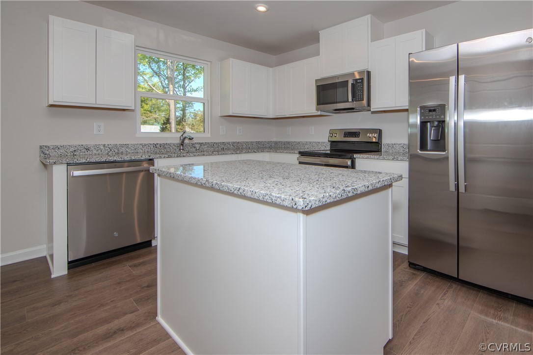 5357 Canterbury Ridge Richmond, VA 23224 - Photo 7 of 14 a kitchen with stainless steel appliances granite countertop a refrigerator sink and microwave