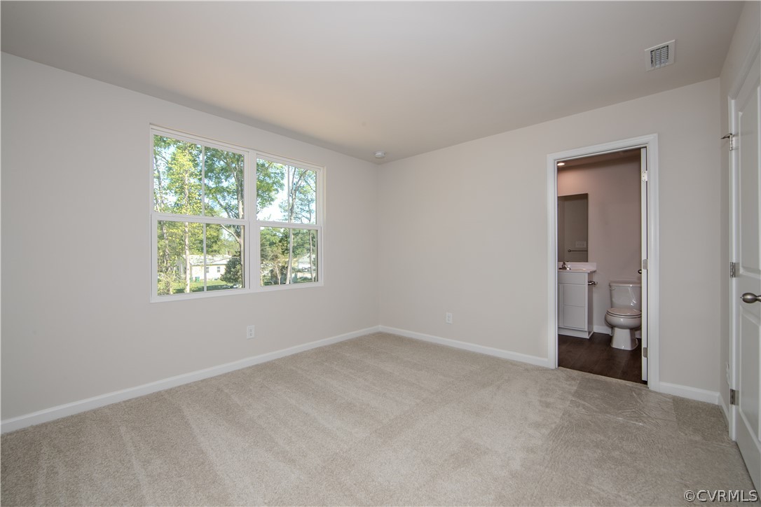 5357 Canterbury Ridge Richmond, VA 23224 - Photo 9 of 14 an empty room with a window