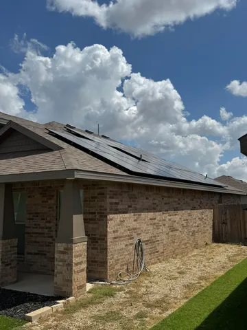 a view of a backyard of the house