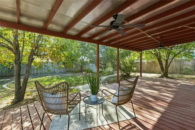a patio with water view fountain with wooden floor and outdoor space