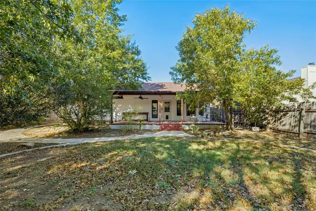 a front view of a house with yard porch and furniture