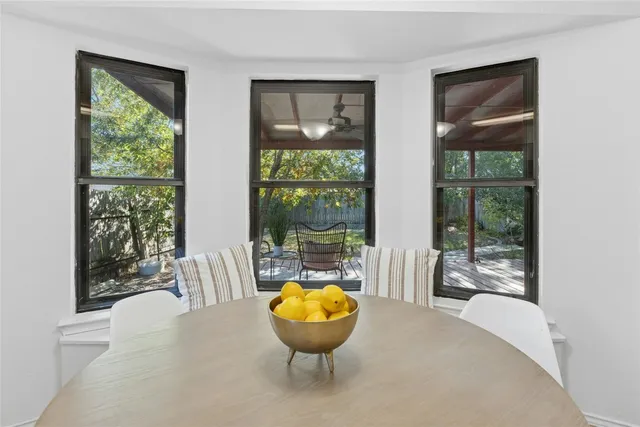a living room with a large tub and windows