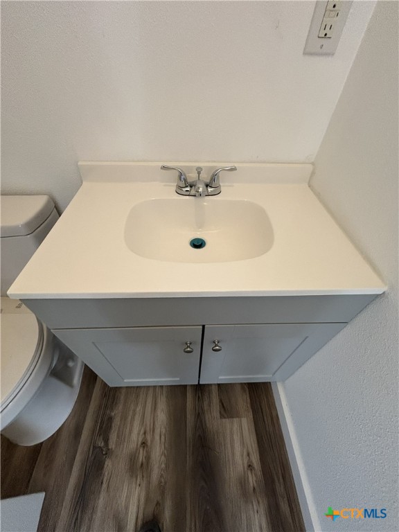 1017 West Nueces Street Victoria, TX 77901 - Photo 18 of 31 a bathroom with a sink and a mirror