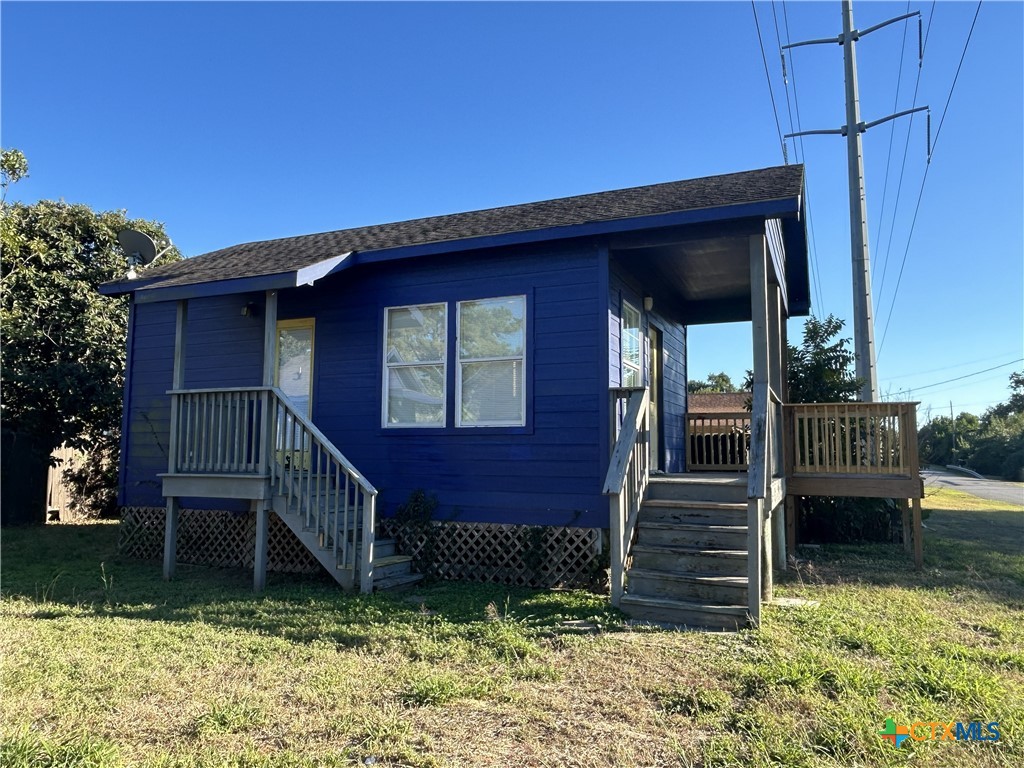 1017 West Nueces Street Victoria, TX 77901 - Photo 24 of 31 a view of a house with a yard
