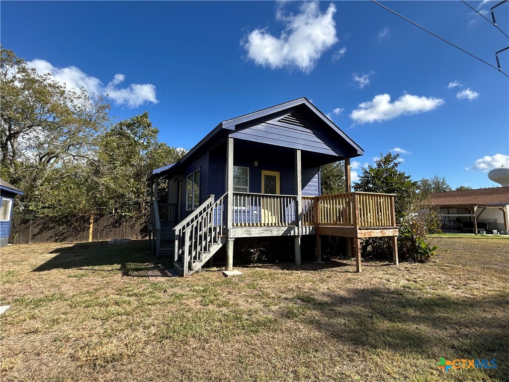 1017 West Nueces Street Victoria, TX 77901 - Photo 7 of 31 a front view of a house with a yard