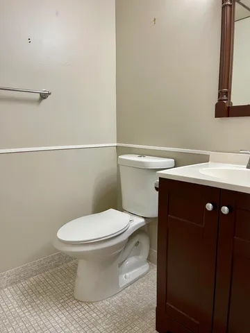 a bathroom with a toilet and a sink