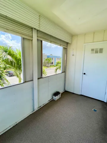 a view of an empty room with a window