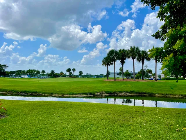 a view of a golf course with a lake