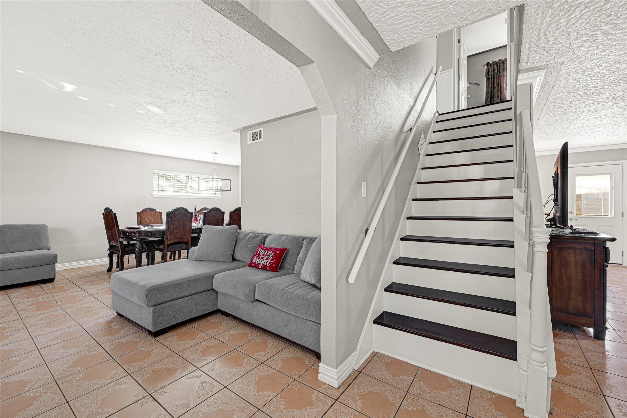 5007 Inverness Drive Baytown, TX 77521 - Photo 10 of 41 a living room with furniture and stairs