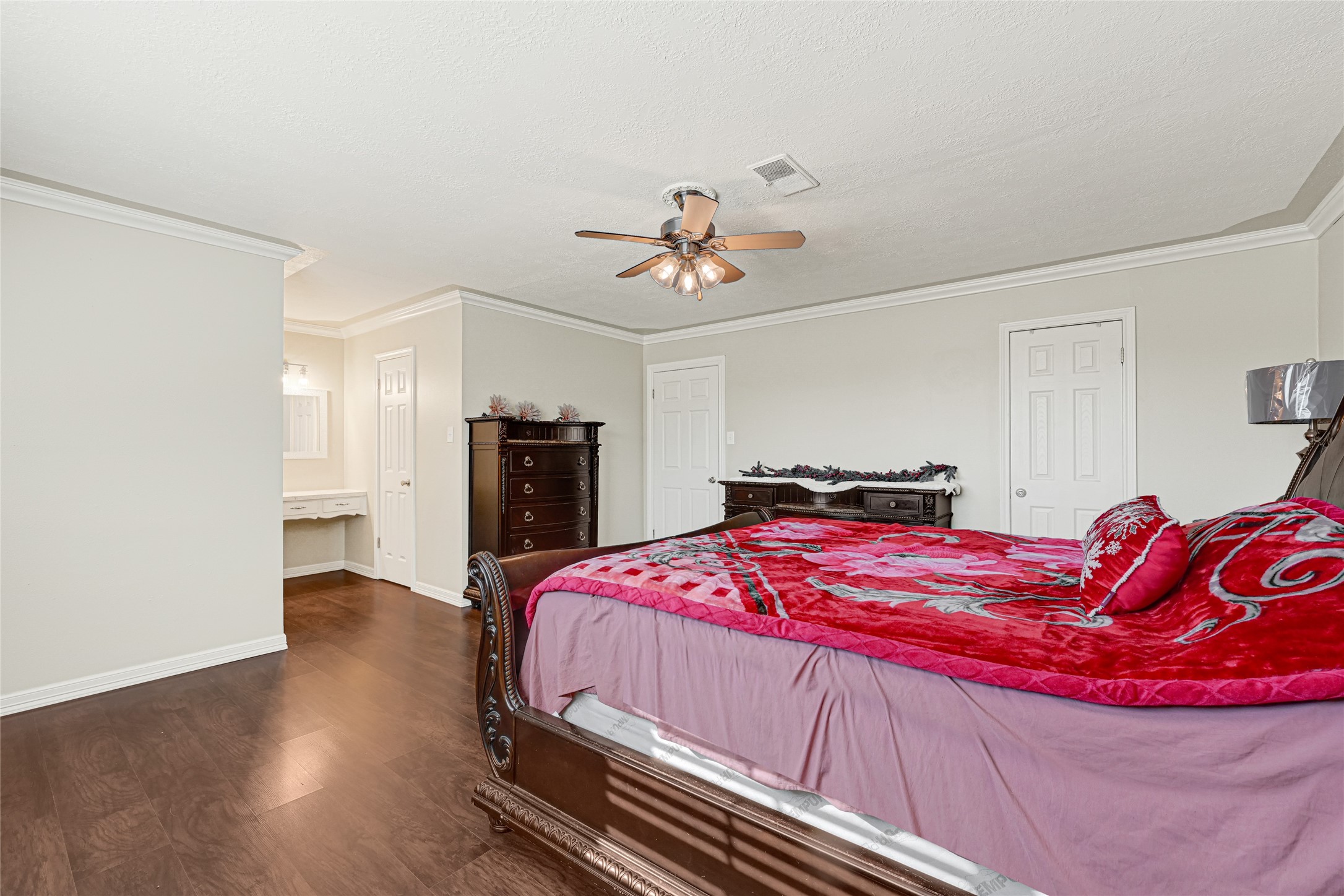 5007 Inverness Drive Baytown, TX 77521 - Photo 15 of 41 a bedroom with a bed and a chandelier