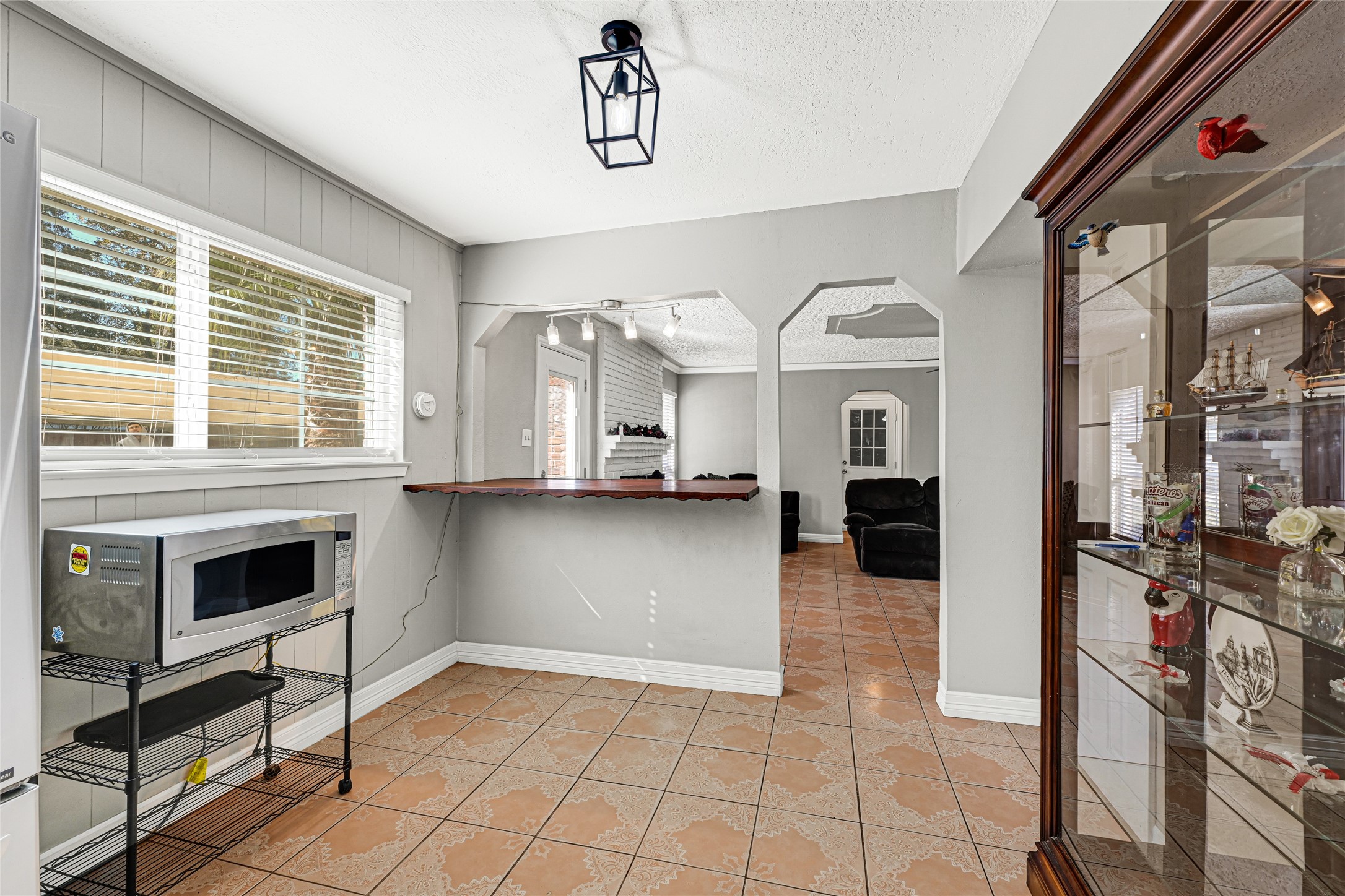 5007 Inverness Drive Baytown, TX 77521 - Photo 27 of 41 a view of living room kitchen with a stove and a large window