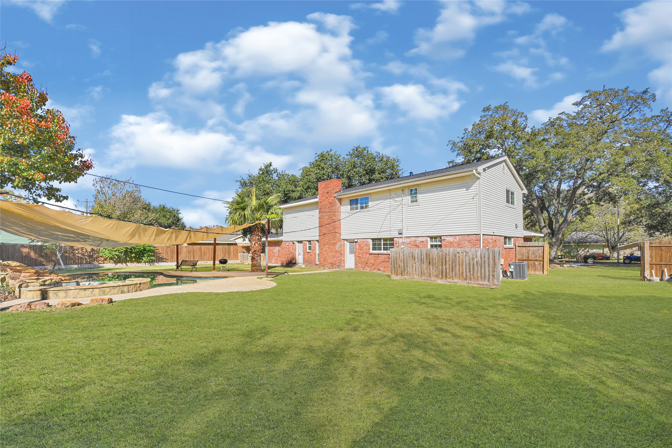 5007 Inverness Drive Baytown, TX 77521 - Photo 40 of 41 a view of a house with a big yard and large trees