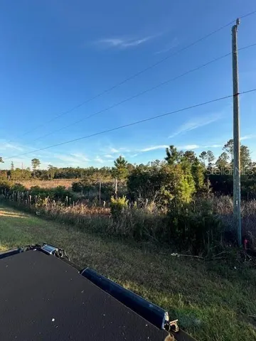 a view of a lake with houses in back