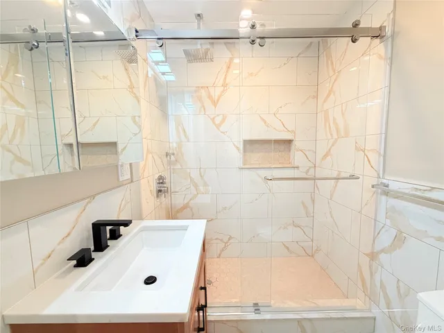 a bathroom with a sink and a shower