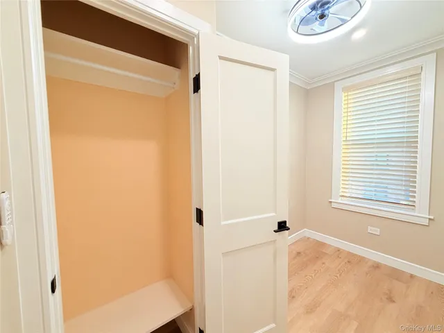 a bathroom with a tub and a window